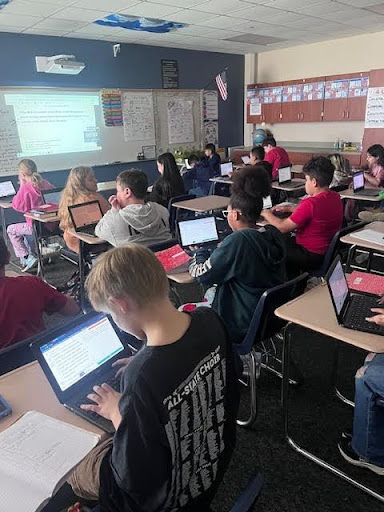 A Bluebonnet lesson running on a Curipod activity slide in a K-5 Texas classroom, students engaged, looking up at the screen.
