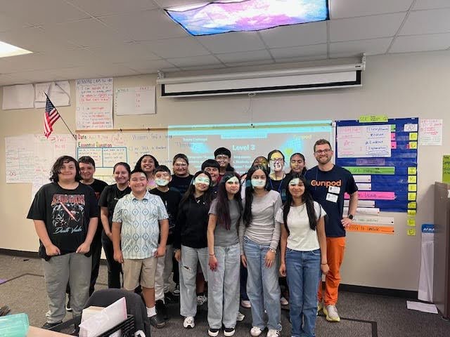 A teacher at the front of the room facilitating a Curipod activity